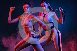 A strong athletic, women on color background wearing in the fashion sportswear, fitness and sport motivation.