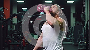 Strong athletic young man working out in gym sport nutrition