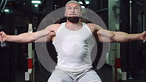 Strong athletic young man working out in gym sport nutrition