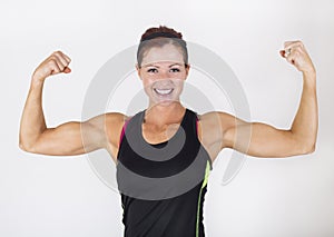 Strong Beautiful Woman flexing her muscles