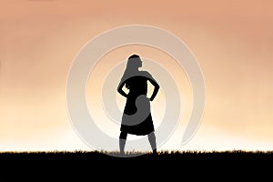 Strong Beautiful Woman Silhouette Isolated Against Sunset Sky Background