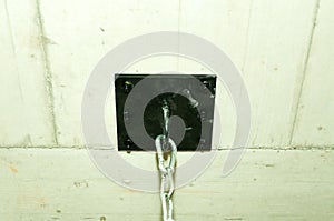 Strong black steel plate bolted in to the ceiling as heavy duty holder of boxing sack.