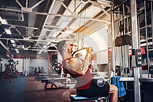 Strong Bodybuilder Doing Heavy Weight Exercise For Back On Machine