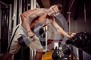 Strong Bodybuilder Doing Heavy Weight Exercise For Back