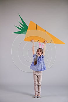 Strong child holding easter banner with copy space