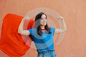 Strong Confident Superhero Woman Flexing her Muscles