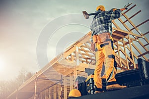 Strong Construction Worker with a Large Hammer Ready For Tough Job