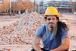 Strong construction worker looking at camera