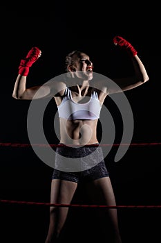 Strong emotions after winning the fight. A young MMA fighter. Hands raised up to prove a huge victory