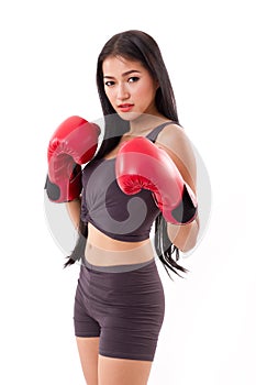Strong fitness woman boxer or fighter assuming fighting stance photo