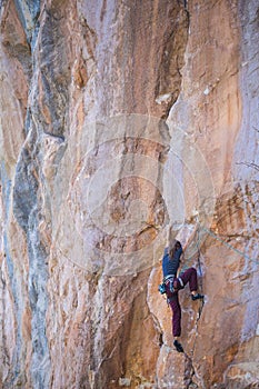 A strong girl climbs a rock, Rock climbing in Turkey