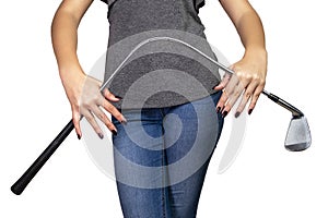 Strong girl with manicured fingernails bending a golf club