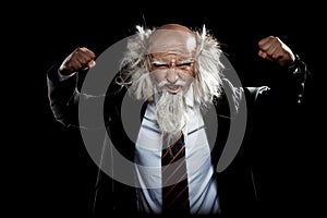 Strong handsome oldman in classic black suit posing