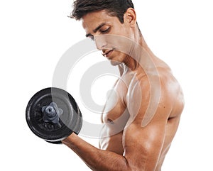 Strong and healthy. A handsome shirtless young man lifting weights against a white background.