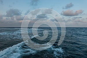 strong high waves at the sea with clouds at the sky