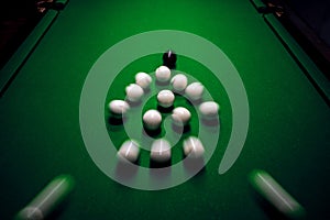 Strong hit by a player with a billiard cue on the ball