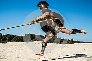 Strong legionnaire`s legs in a jump on the opponent photo