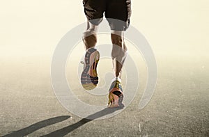 Strong legs and running shoes of sport man jogging in fitness healthy endurance concept in advertising style