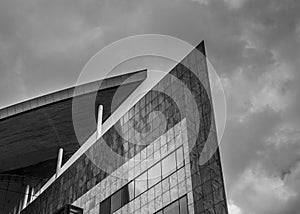 Strong lines and shapes of a high rise building, rendered in black and white to accentuate the shapes