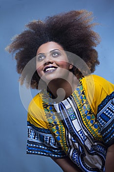 Strong make up african american woman looking up