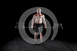 Strong man deadlifts a lot of weight