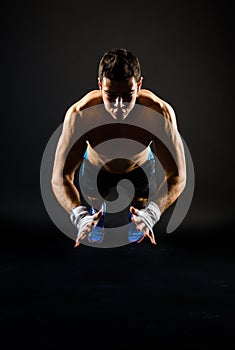 Strong man doing jumping push-ups