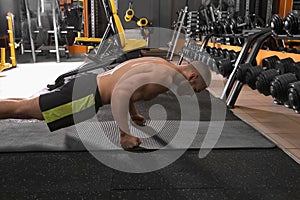 Strong man doing plank exercise