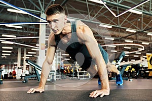 Strong Man Doing Push Ups in Gym