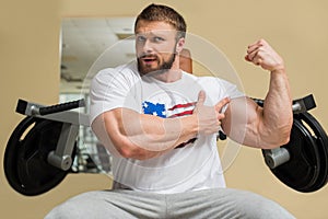 Strong man with huge muscles.