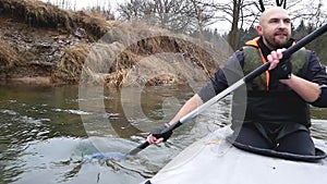 Strong man swim on Kayak On The River.Male Swimmimg On Canoe. Enjoying Views. wild nature