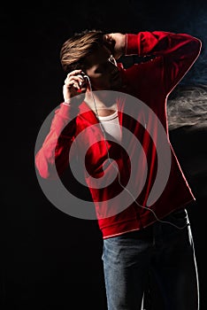 Strong man wear red hoodie over black background