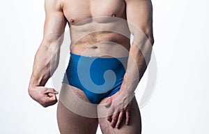 Strong manliness muscular man in underwear. Man panties. photo