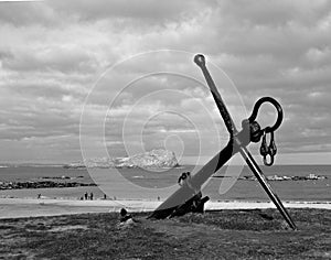 A strong metal anchor at the beach. photo