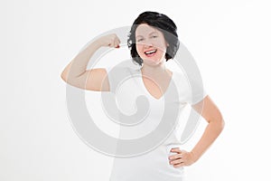 Strong middle age woman showing her muscularity and looking at camera isolated on white. Copy space and blank template t shirt