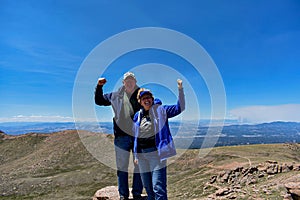Strong Old Married Couple Enjoying the Top of Pike`s Peak