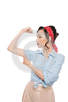 Strong pin up woman showing muscles