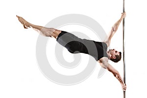 Strong pole dancer smiling man in black clothes on pylon. White background