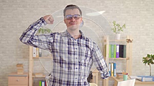 A strong positive male disabled with an amputated hand poses in the camera