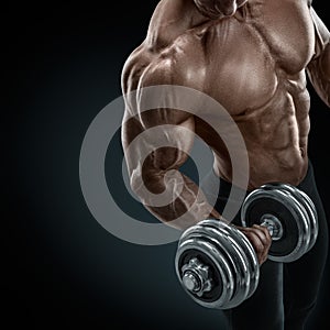 Strong and power bodybuilder doing exercises with dumbbell