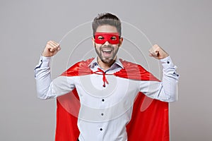 Strong powerful business man in shirt superhero suit have supernatural abilities isolated on grey background