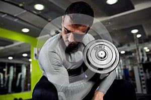 Strong powerful male exercise biceps