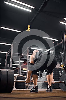 Strong powerlifter in gym