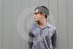 Strong and serious young black man in profile over a neutral background, natural dreadlock hairstyle