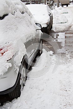 After a strong snow storm car covered in snow