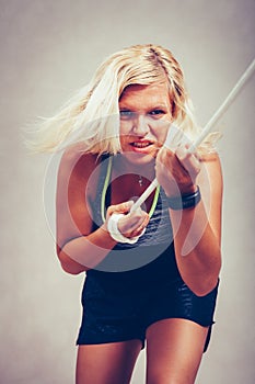 Strong sporty woman pulling rope