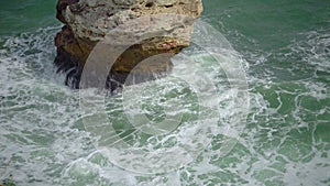 Strong storm near a rocky coast, white waves with foam in the sea, Black Sea, Bulgaria