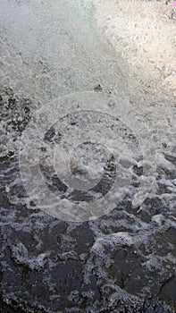 Strong stream through summer park