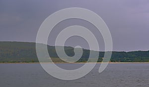 Strong summer storm. Water bubbles formed on the surface of the lake due to heavy rain