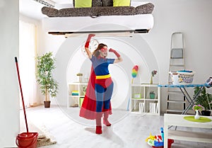 strong super hero woman holding bad in the air