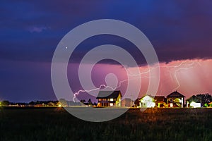 Strong Thunderstorm with rain over the village street